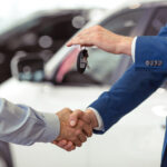 Customer receiving keys to new vehicle at our Ford dealership